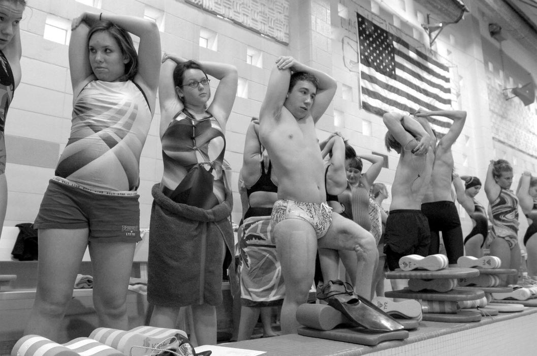 Third Place, Sports Picture Story - Abogail Bobrow / Sandusky RegisterDustin Muirhead (fourth from the left) stretches with the Port Clinton High School swim team before practice. Dustin says his coach Danny Diaz "doesn't look at me differently. He doesn't give me a workout that's less."