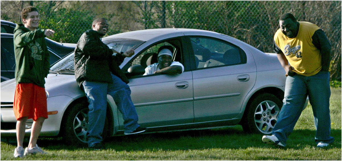 Award of Excellence, Sports Picture Story - Ed Suba, Jr. / Akron Beacon JournalA group of players from another team in the league, a constant at practice and games during the season, laugh as members of the Ohio Valley Bengals have problems while running plays during a practice session at Goodyear Middle School in Akron. Despite trying hard, team ability was not high and this type of joking and ridicule was common during the season, especially from players on other teams.