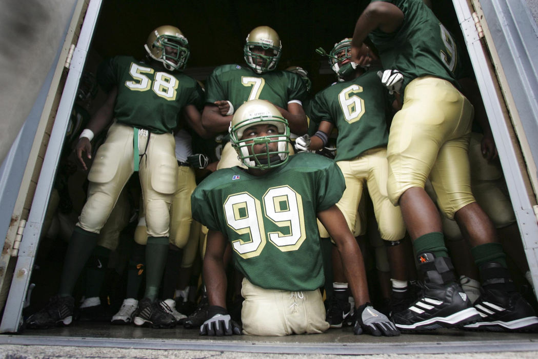 Award of Excellence, Sports Picture Story - Jim Witmer / Dayton Daily NewsColonel White's Bobby Martin waits with teammates at the lockerroom door before entering the playing field for a game vs. Dunbar. 