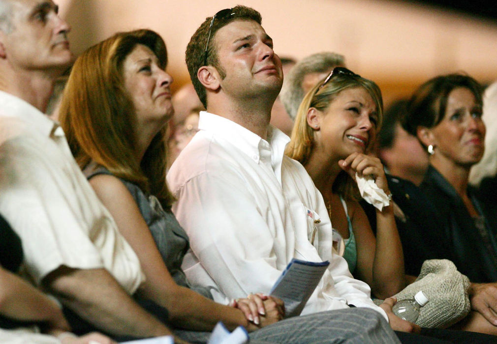 Second Place, Team Picture Story - DALE OMORI / The Plain DealerThe family of Jeffrey Boskovitch break down during the community memorial service at the International Exposition Center.