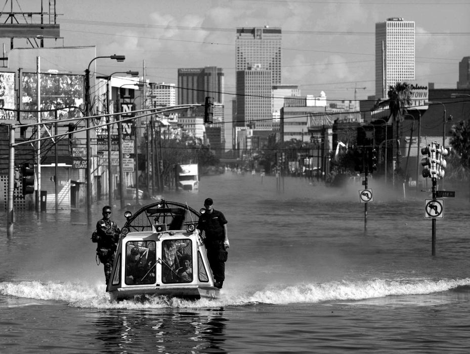 First place, Team Picture Story - Scott Shaw / The Plain DealerKatrina's Wrath - The following team picture story represents the work of three Plain Dealer photographers sent to cover the aftermath of Hurricane Katrina in New Orleans and the Mississippi Gulf Coast. One of three U. S. Coast Guard ice boats comes back with Hurricane Katrina victims. Forty-three members of the Coast Guard's Search and Rescue Detachment for the Great Lakes Region were helping in the New Orleans disaster.