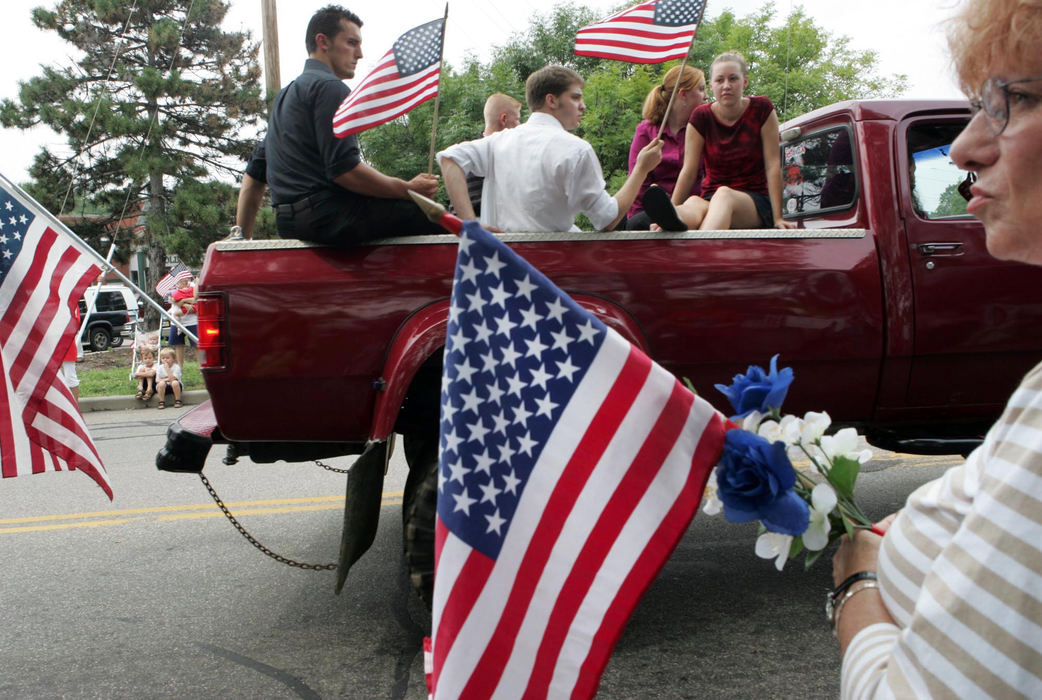 Second Place, Team Picture Story - Mike Levy / The Plain DealerThe funeral procession for Lance Cpl. Daniel Nathan Deyarmin Jr., who loved cars, featured the trucks and automobiles of many of his friends and neighbors.