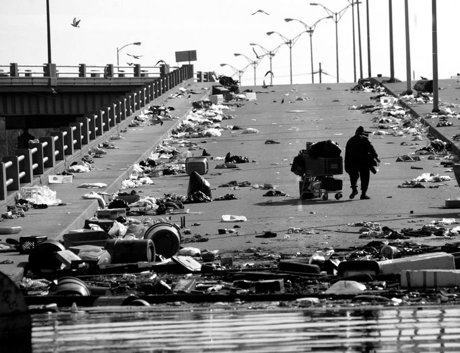 First place, Team Picture Story - Scott Shaw / The Plain DealerA New Orleans resident tries to find salvageable items on an I-10 ramp where many people had stayed days earlier.  