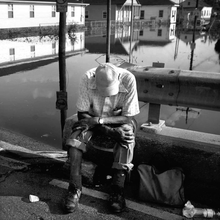 First place, Team Picture Story - DALE OMORI / The Plain DealerJames Cooper, 91, sits on the St. Claude Ave. Bridge after being rescued from the flooded out Arabi section of New Orleans, Sept. 4, 2005.