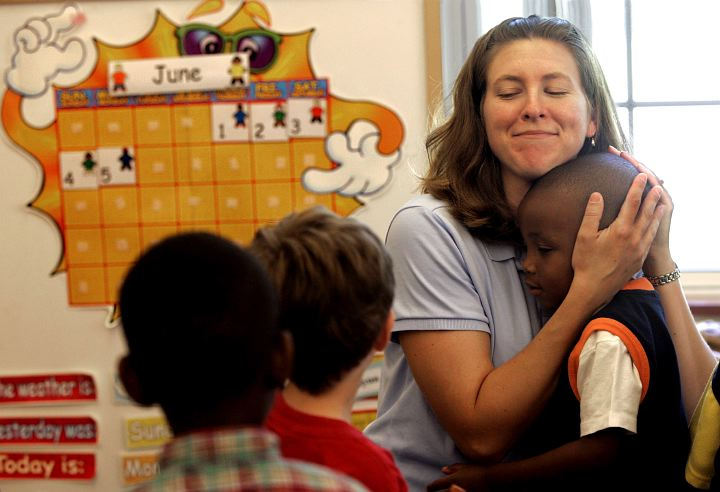Second Place, Enterprise Feature - Lynn Ischay / The Plain DealerMiss Jamie Alspach gets big goodbye hugs from the preschool class at the Achievement Centers for Children in Highland Heights. It was the last day of Miss Jamie's music class before summer break. 