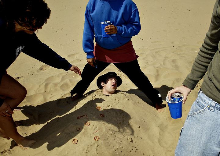 Award of Excellence, Enterprise Feature - Greg Ruffing / FreelanceA group of college students bury a friend in the sand while partying along the shores of Lake Michigan in Chicago to celebrate the end of their semester.