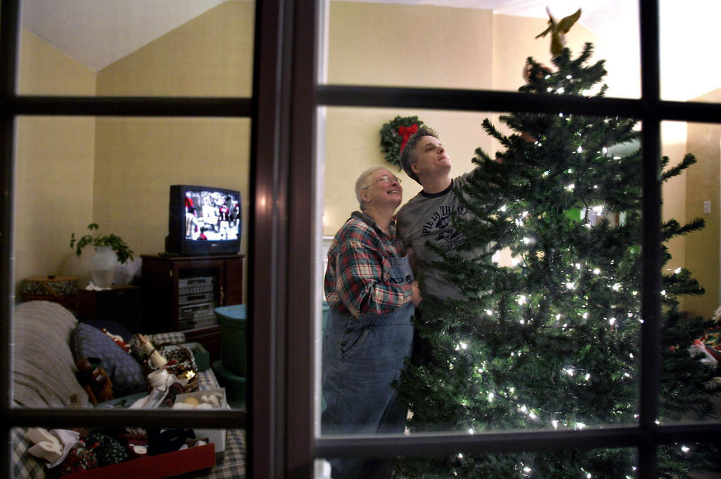 Second Place, Feature Picture Story - Chris Russell / The Columbus DispatchAfter being in and out of the hospital for weeks, Audrey and Lee get to spend some time at home decorating their Christmas tree during a break in Audrey's chemotherapy routine.  
