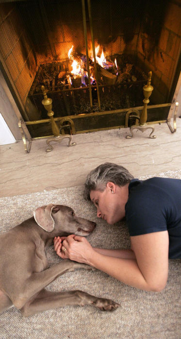 Second Place, Feature Picture Story - Chris Russell / The Columbus DispatchLying on the living room floor  with the couples dog Libby, Lee spends time at home without Audrey.  Audrey's health and fight with cancer continues and her long term prognosis is unknown.