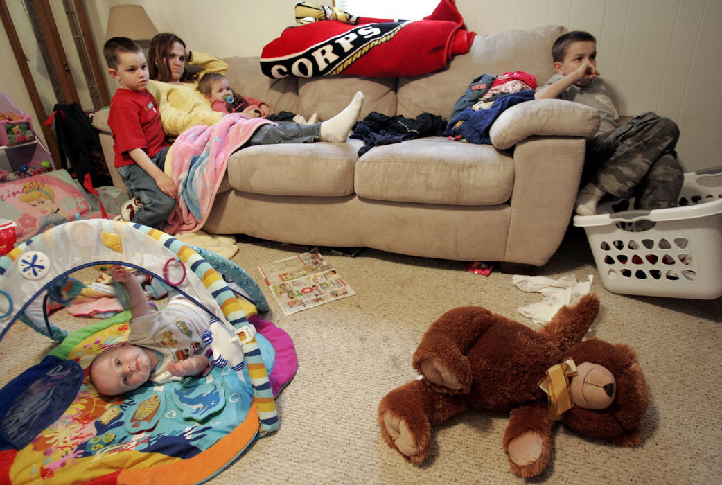 Third Place, Feature Picture Story - Chris Russell / The Columbus DispatchAt the end of a long day, Lee Ann and all the kids sit down to watch a movie.  The family left the Marine base where they had been living to be closer to their relatives in Galion.  