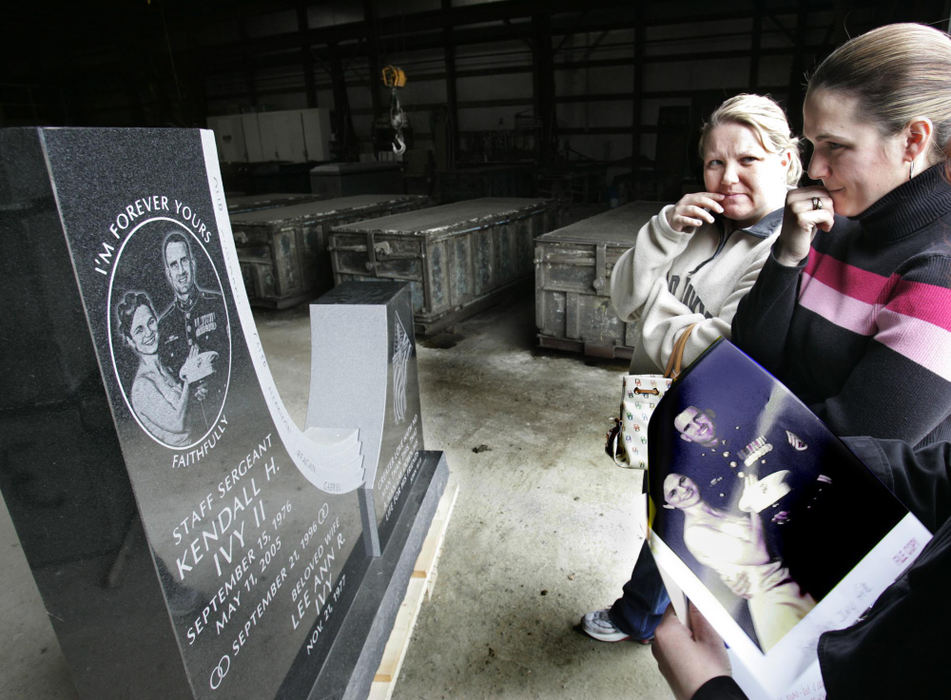 Third Place, Feature Picture Story - Chris Russell / The Columbus DispatchLee Ann ponders her husbands gravestone likeness as her niece Aleta Rowe looks on for her reaction.  The photo in the bottom right corner is the one used in the etching and is being held by an employee of the memorial company.  
