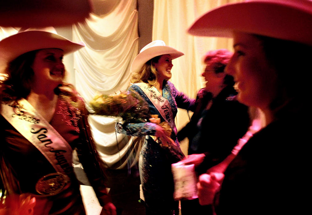 Award of Excellence, Feature Picture Story - Greg Ruffing / FreelanceFamily members, contestants and pageant organizers gather to congratulate Joanna Blackwell (center) of Center, Texas, after she was crowned the new Miss Rodeo Texas at the final Coronation in San Antonio. Miss Blackwell will now go on to represent Texas in the Miss Rodeo America Pageant in Las Vegas, as well as tour the country doing promotional appearances.