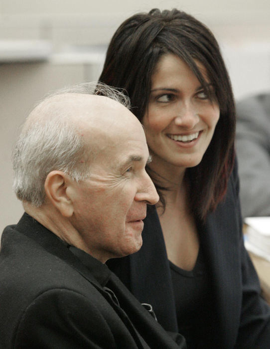 First Place, News Picture Story - Andy Morrison / The BladeRev. Gerald Robinson, left and defense attorney Nicole Khoury laugh as defense attorney John Thebes has trouble with a display during his murder trial.