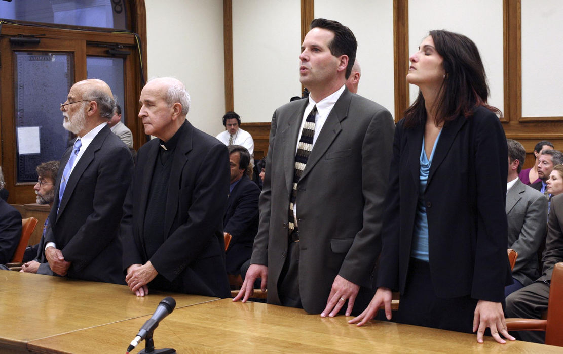 First Place, News Picture Story - Andy Morrison / The BladeDefense attorney Alan Konop, (left) Rev. Gerald Robinson, defense attorneys John Thebes and Nicole Khoury (right) listens as the guilty verdict is read.  Robinson was found guilty in the 1980 murder of Sister Margaret Ann Pahl.  