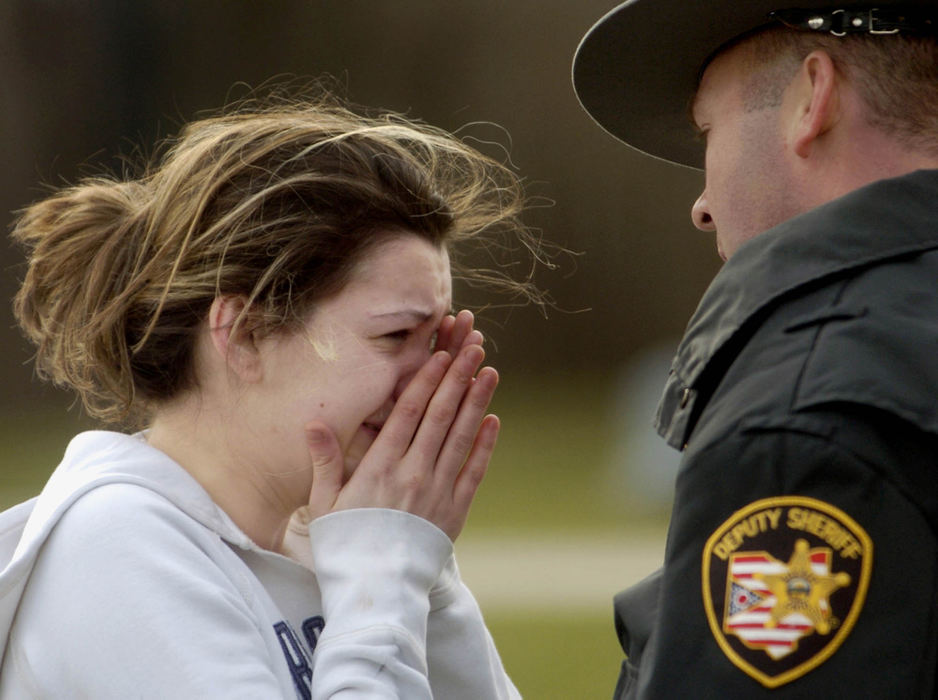 Second Place, News Picture Story - Marsahll Gorby / Springfield News-SunNeighbors in a rural Clark County community rallied with law enforcement to search for a toddler who left his panicked family behind when he wandered from his house Feb. 2. Emotions ran high during the four-hours search, until a neighbor saw the 2 1⁄2-year-old boy curled up in her lawn, about a half-mile from home. Angel Schneider cried as she answered questions from a sheriff's deputy about her missing son, Cayden Workman. 