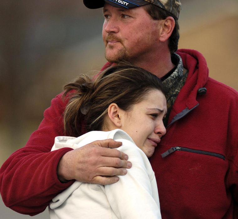 Second Place, News Picture Story - Marsahll Gorby / Springfield News-SunAngel Schneider is hugged by her father as she waits to hear news about her missing son.