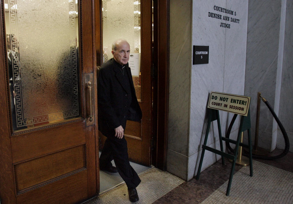 First Place, News Picture Story - Andy Morrison / The BladeRev. Gerald Robinson leaves the courtroom for during a break in his murder trial. Robinson, a Roman Catholic priest, is accused of killing a nun over Easter weekend 26 years ago.