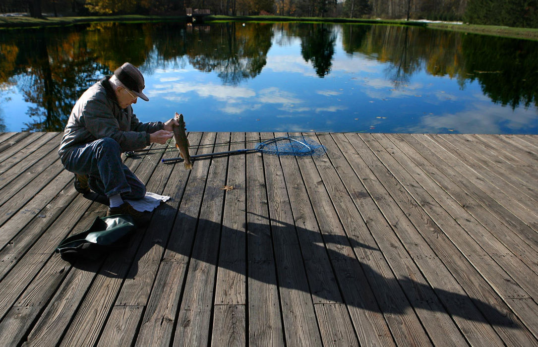 First Place, James R. Gordon Ohio Understanding Award - Lynn Ischay / The Plain DealerThe Daily Life is a weekly photo column that offers readers a glimpse of their community through the visual reporting of photographers. Frank Glick makes his fishing line dance and skate over the clouds reflected on the calm, spring-fed lake in Chardon. And for the first time this bright Thursday morning, he gets a bite. “The fish are really rising today, but that doesn’t necessarily mean they’ll bite,” Glick 