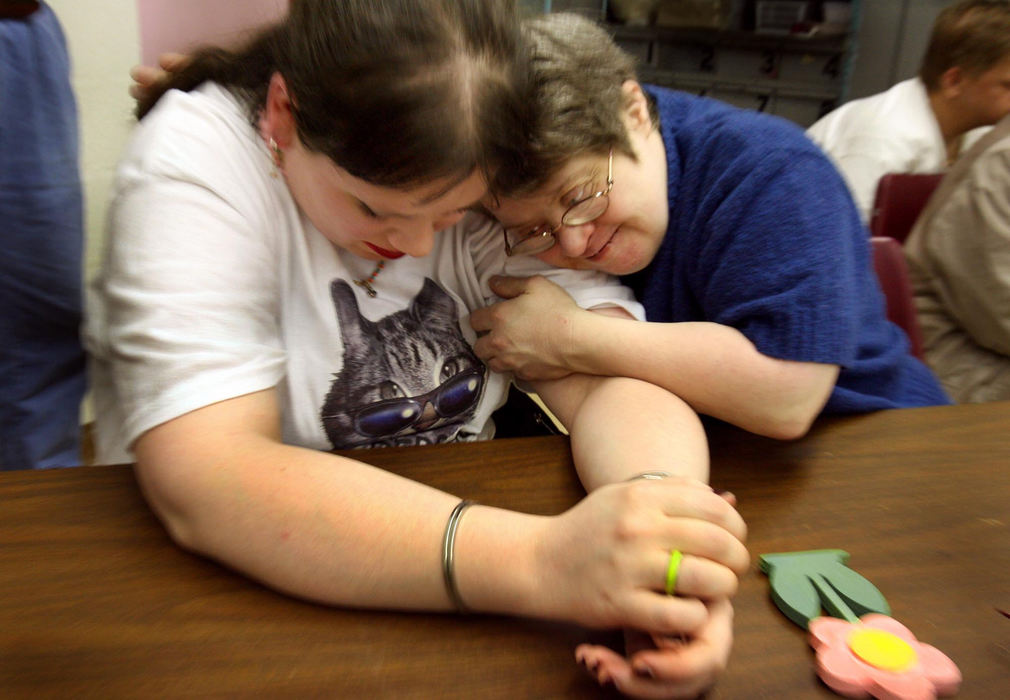 First Place, James R. Gordon Ohio Understanding Award - Lynn Ischay / The Plain DealerExcited conversation bounces around the room in the Very Special Arts class for disabled adults at the Schaaf Community Center in Parma. Lorie Koehler leans into her work, mixing paints to find the right colors for her wooden flower magnet, one of the 38 hands-on activities that will be offered May 11 at “Dig The Arts — A VSA Garden Party” at the Cuyahoga County Fairgrounds in Berea. “See what I did with the paint?” she asks, swirling red and white together to make a perfect petal pink. “I'm clever.”