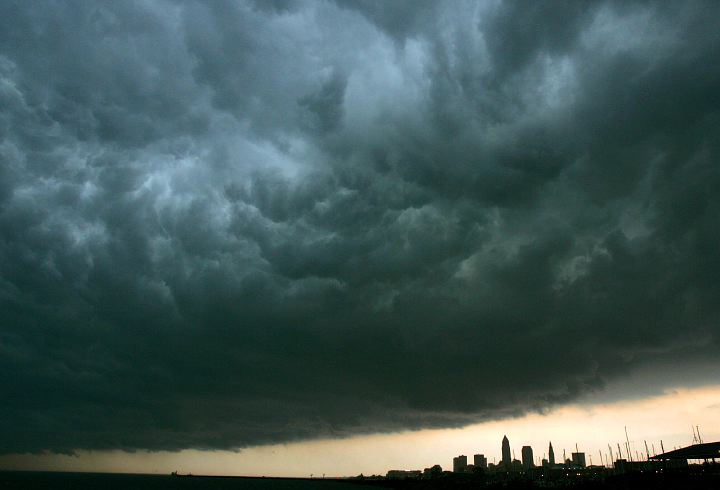 Award of Excellence, Pictorial - Joshua Gunter / The Plain DealerThe Cleveland skyline is dwarfed by a storm front that rolls overhead, May 25, 2006. The front that was nearing Cleveland was approaching from the Northwest and was photographed from Edgewater Park. 