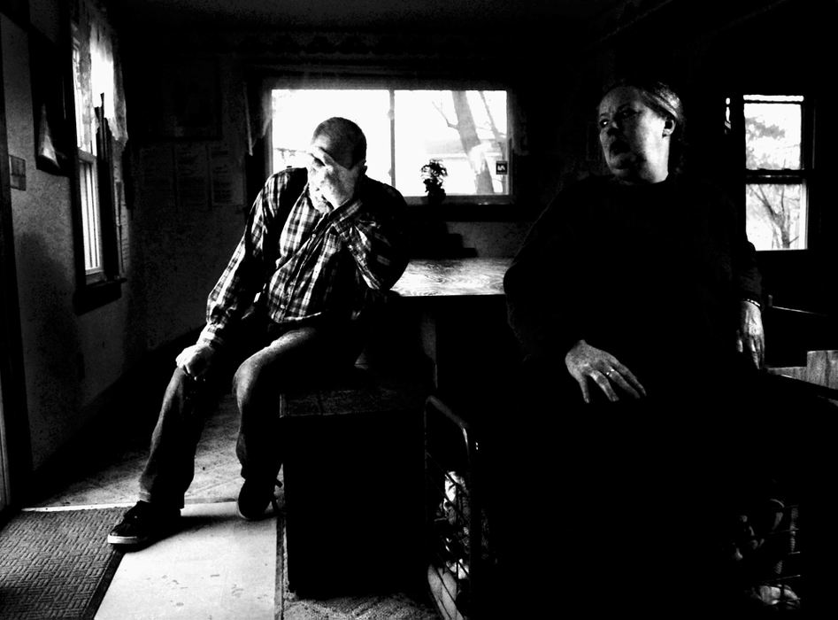 Third Place, Photographer of the Year - Greg Ruffing / FreelanceMichael (left) and Sharen Gravelle sit at the dinner table where they used to feed their 11 adopted children at their home in Clarksfield Township. In early 2006, the Gravelles were accused of making the children sleep in cages, among other harsh forms of parenting brought to light by Huron County Job and Family Services. They were indicted and eventually convicted on 11 criminal charges including child endangering and child abuse. Their children have since been placed in foster care. The Gravelles are currently seeking a new trial.