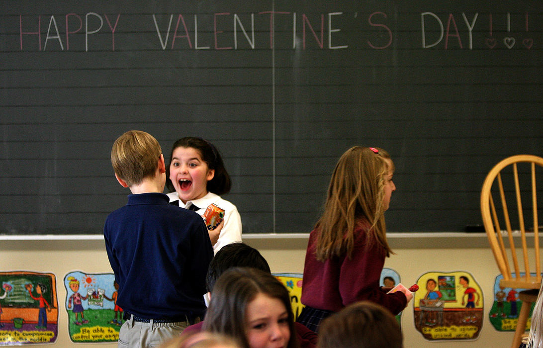 Award of Excellence, Photographer of the Year - Dale Omori / The Plain DealerKatie Gray laughs while talking to classmate Jaret Pustai during their Valentine's Day party Feb. 14, 2006, Lakewood, Ohio.  They are members of Tammy Pollock's second grade class at Lakewood Catholic Academy.