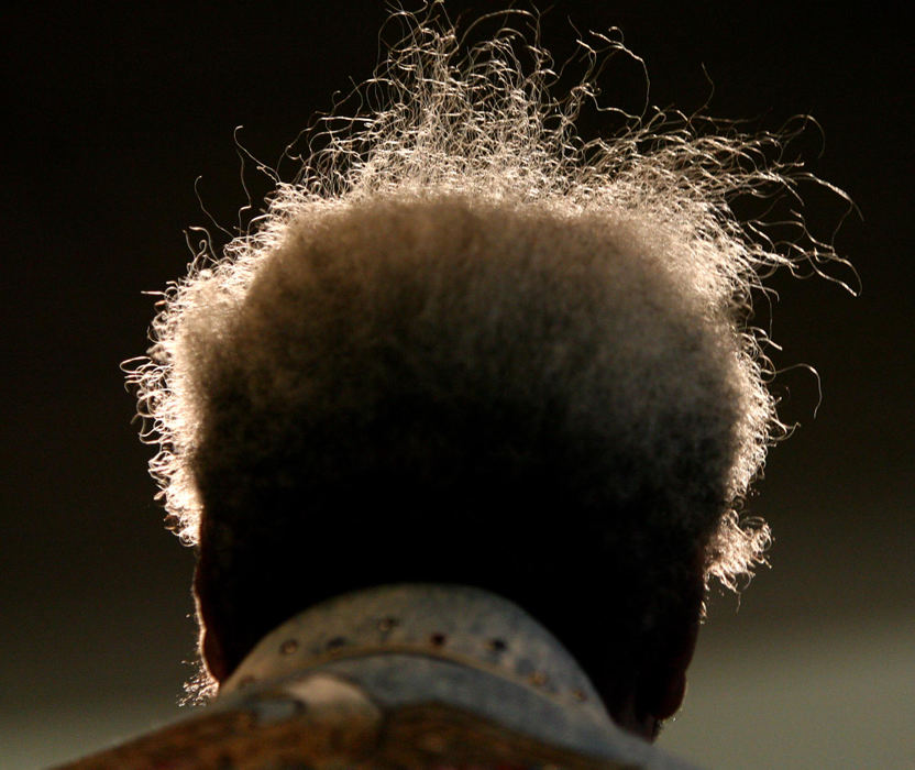 Award of Excellence, Photographer of the Year - Dale Omori / The Plain DealerDon King's hair is lit up by television lights during press conference, Mar. 8, 2006, at the CSU Wolstein Center promoting upcoming fight between Lamon Brewster and Sergei Liakhovich. 