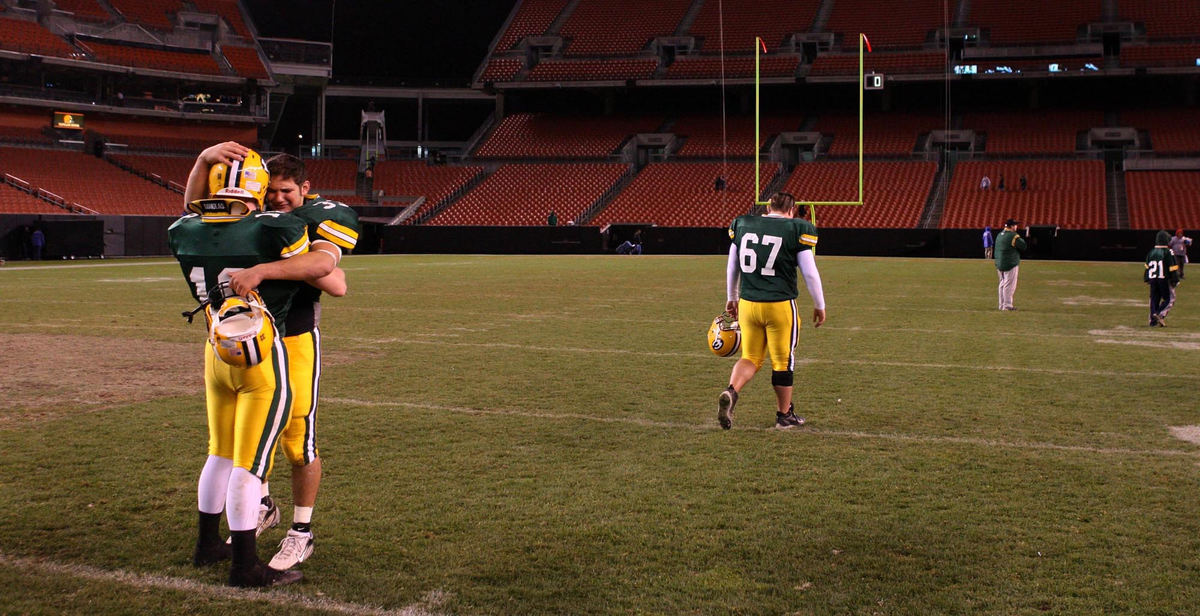 Award of Excellence, Photographer of the Year - Dale Omori / The Plain DealerSt. Edward's Cory Skoczen (18) and Tarik Raed linger on the field and console each other after their 7-3 loss to Warren G. Harding, Nov. 11, 2006, at Cleveland Browns Stadium.