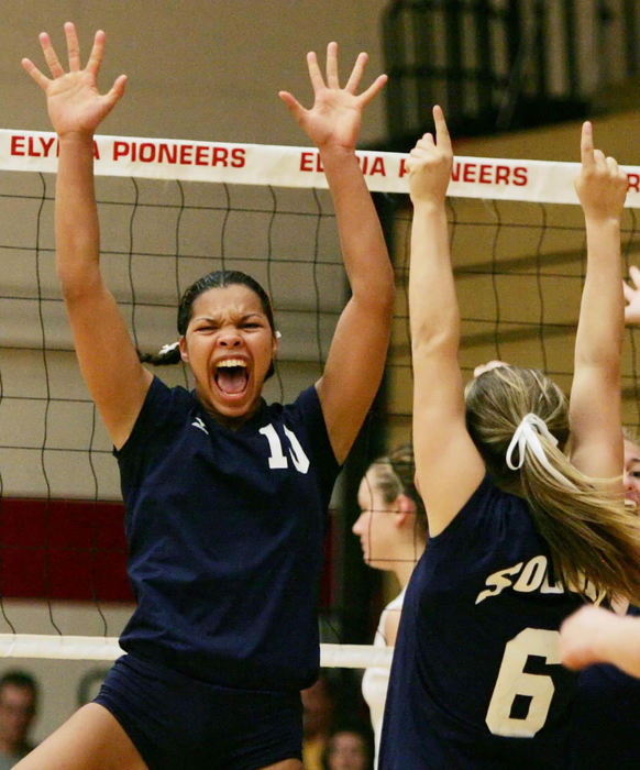First Place, Photographer of the Year - John Kuntz / The Plain DealerSolon High's Kayla Jeter celebrates her block and a score with her teammates against Elryia High in the first match of the championship game during the Elyria Power Quad volleyball tournament hosted by Elyria September 30, 2006.  