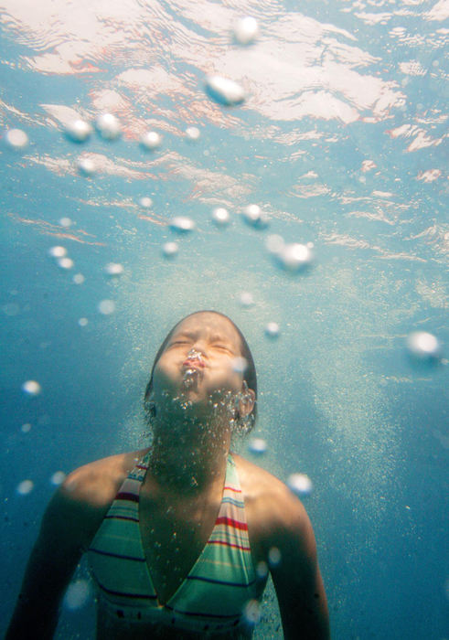 First Place, Photographer of the Year - John Kuntz / The Plain DealerGabby Theriot, 10, of Columbia Station comes out of the depths of her aunt's pool to the surface after a dive into the pool escaping the heat of the day July 26, 2006 in Olmsted Township. 