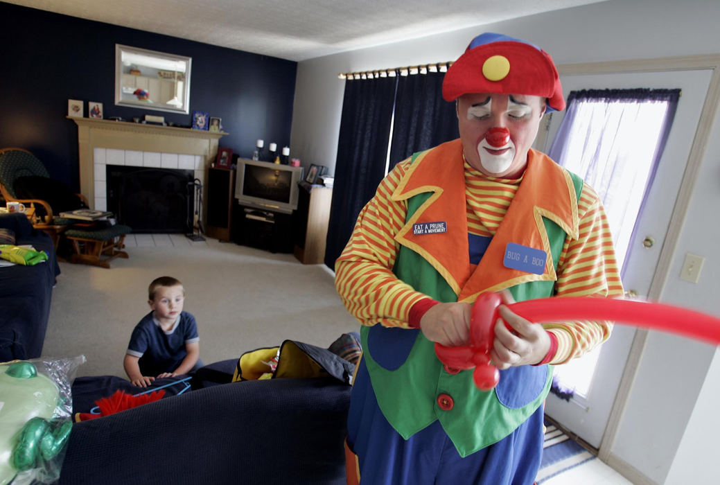 Second Place, Photographer of the Year - Chris Russell / The Columbus DispatchMatthew brushes up on his balloon tying skills before heading off to his first party since coming back from serving in Iraq.  Zachary was looking on hoping to get the balloon animal that his father creates.  