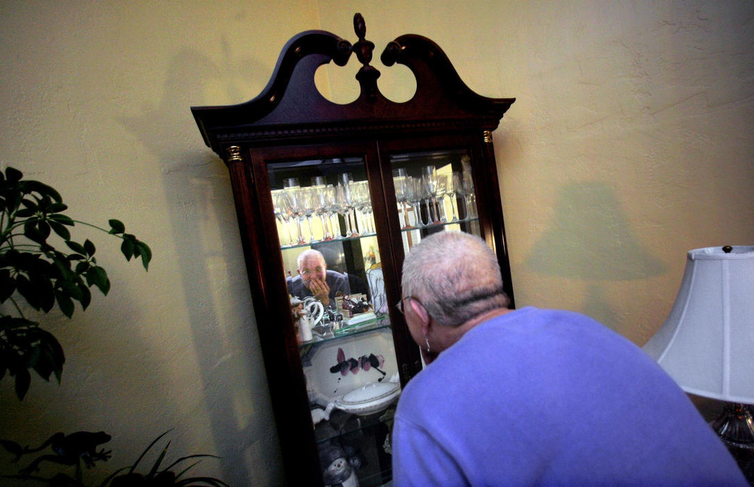 Second Place, Photographer of the Year - Chris Russell / The Columbus DispatchAudrey gasps with surprise after staring into the living room cabinet and seeing her newly shaved bald head following an elaborate ceremony at home to shave it.  