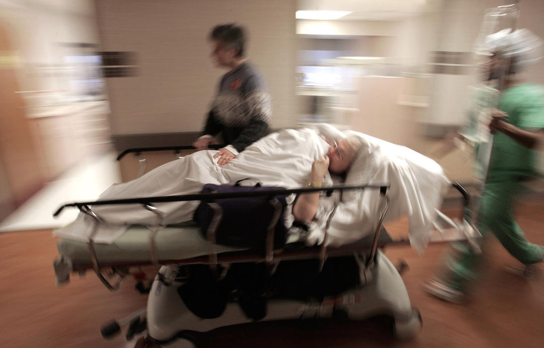 Second Place, Photographer of the Year - Chris Russell / The Columbus DispatchLee accompanies Audrey as she is wheeled into a room at the Arthur James Cancer Center after spiking a high temperature following another round of chemotherapy.  Chemotherapy destroys Audrey's immune system and any infection could be fatal.