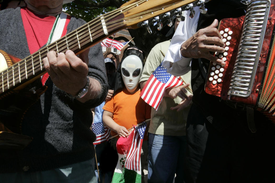 Second Place, Photographer of the Year - Chris Russell / The Columbus DispatchOutfitted as an "alien" Concepcion Luna, 9, joined protestors in front of Congressman Paul Gillmor's office in Toledo to protest his support for the Sensenbrenner Bill on immigration.  Her mother said she was an alien on a mission of peace.  