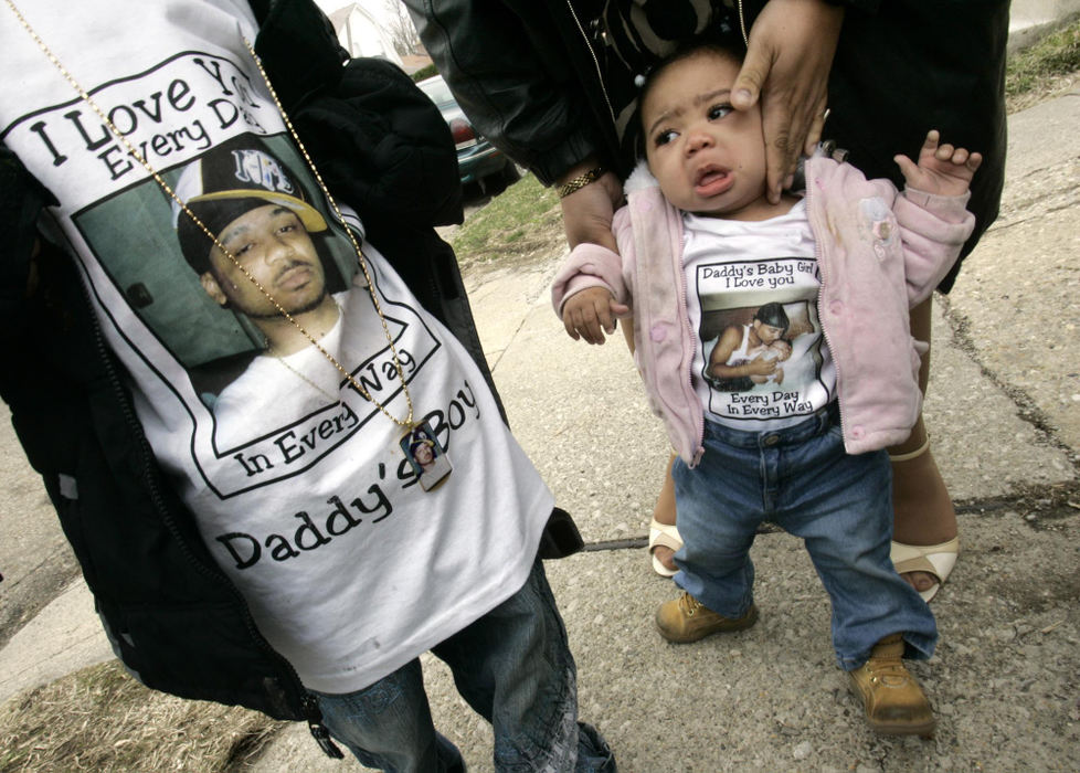 Second Place, Photographer of the Year - Chris Russell / The Columbus DispatchAntoine Patterson Jr, 4, and sister Kalyn Patterson, 8 months, were dressed in special commemorative t-shirts for their father's funeral. Antoine M. Patterson was shot to death in a still unsolved murder. 