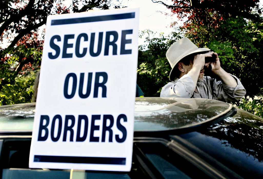 Third Place, Photographer of the Year - Greg Ruffing / FreelanceTerry Schrader, a volunteer for the Washington state detachment of the Minuteman Civil Defense Corps, keeps watch along the U.S.-Canada border near Blaine, Washington. The Minutemen, more widely know for their activity along the U.S.-Mexico border, have set up eight patrol posts along the border in Washington between Blaine and Sumas. The Minutemen say that if they were to witness illegal activity at the border, their policy is not to intervene, but rather to notify U.S. Border Patrol and local law enforcement.