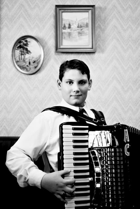 Third Place, Photographer of the Year - Greg Ruffing / FreelanceFor nearly 25 years they've met in Euclid, the self-proclaimed "Polka Capitol of the U.S.," home of the Polka Hall of Fame: accordion and button box players and other polka musicians, fans, collectors and aficionados. Anthony Culkar, age 13, of North Royalton, poses for a portrait with his accordion. Having learned the instrument from his father, Anthony is now a student of Fred Ziwich, among the most revered polka musicians in the country.