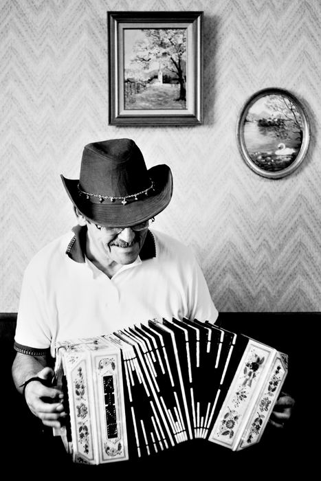 Third Place, Photographer of the Year - Greg Ruffing / FreelanceJohn Carroll of Brookpark with one of six instruments from his collection of accordions and button boxes. He is also a member of the polka band Buttonaires.
