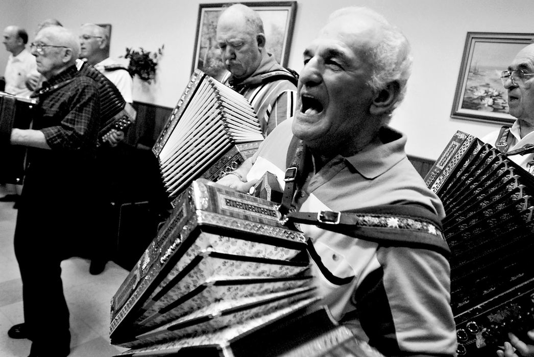 Third Place, Photographer of the Year - Greg Ruffing / FreelanceHank Zuzek of Beamsville, Ontario, erupts in song during a large jam session in a side room during the Super Button Box Bash.