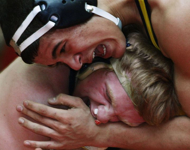 First Place, Sports Action - Amy E. Voigt / The BladeTom Schoen from St. John's (left) and Mustafa Eltataway, from Whitmer in the 189 weight class try to win by biting during the Toledo City League Wrestling Tournament on February 11, 2006.