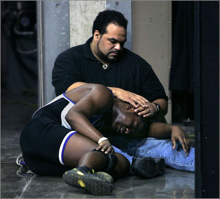 First Place, Sports Feature - Ed Suba Jr / Akron Beacon JournalCuyahoga Valley Christian Academy wrestler, Justin Tripp, is comforted by his father, Christopher, after Tripp lost his 171 lb. Division II semi-final match against Todd Neptune from New Concord John Glenn, 7-6, as time ran out, at the 2006 Ohio state wrestling championships at the Jerome Schottenstein Center on  March 3, 2006 in Columbus. 