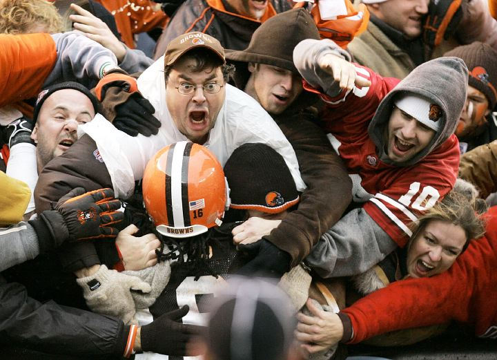 Second Place, Sports Feature - Tony Dejak / Assocaited PressCleveland Browns defensive back  Daven Holly (39) is mobbed by fans after Holly returns an interception 57 yards for a touchdown against the Pittsburgh Steelers  in the first quarter of a game, Nov. 19, 2006, in Cleveland.