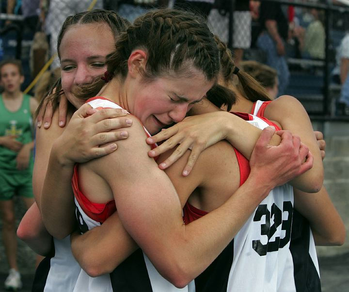 Award of Excellence, Sports Feature - Phil Masturzo / Akron Beacon JournalCrestwood High School's Bridget Franek (center),  is congratulated by her 4x800 meter relay teammates after placing first in Division II regional track  meet on May 25, 2006  at Ravenna Stadium. They  qualified for the state meet in Columbus.  