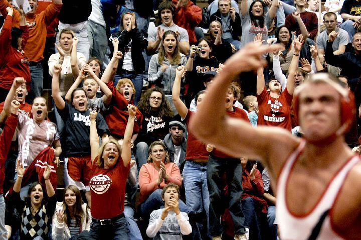 Award of Excellence, Sports Feature - Rami Daud / Kent State UniversityThe crowd cheers for Wadsworth's Derek Foore after he defeated Dustin Kilgore of Berea during their 171 weight class championship match at the Grizzly Invitational.