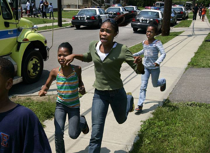 First Place, Spot News over 100,000 - Joshua Gunter / The Plain DealerFour children that were taken in a van during a high-speed police chase run to be reunited with their mother after the chase ended June 29, 2006 in Cleveland. Police chased the van around eastern Cleveland until it turned onto Catalpa, a dead-end road where the driver, a man that may be their father, fled on foot. Police pursued and tasered the man in a back yard of a home. 