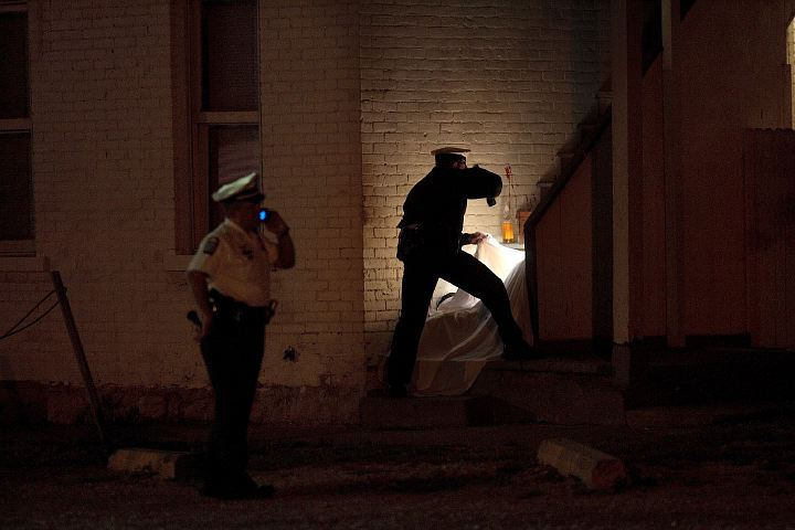 Third Place, Spot News over 100,000 - James D. DeCamp / The Columbus DispatchColumbus Police look over the scene of a homicide behind 1300 East Broad Street October 5, 2006 where a male victim had been shot at about 10:30 PM. Police detained 5 people from from a house at 24 North Princeton where witnesses said that the shooter had run to after the crime.