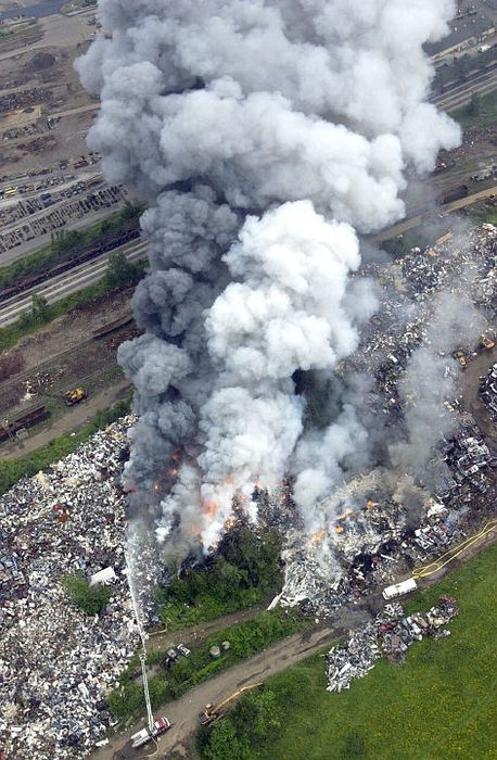 Award of Excellence, Spot News under 100,000 - Michael S. Balash / The RepositoryMore than ten fire departments were called to PSC Metals Inc. located at 3101 Varley Ave SW in Canton Township, for a fire that continued to burn for days. It appeared that junk vehicles were burning. Smoke was visible for miles around.