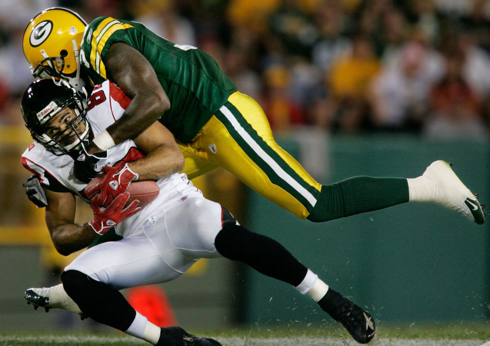 Second Place, Student Photographer of the Year - Michael P. King / Ohio UniversityGreen Bay Packers safety Nick Collins (36) lays a hit on wide receiver Jerome Pathon (82) of the Atlanta Falcons in the final minute of the second quarter of the preseason game at Lambeau Field in Green Bay, Wis., Aug. 18, 2006.