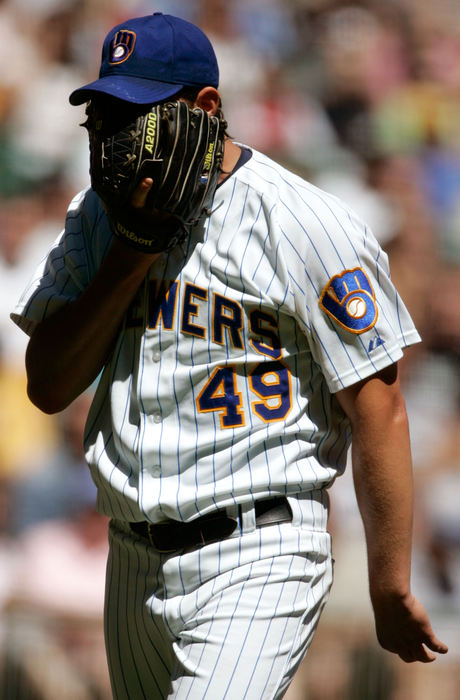 Second Place, Student Photographer of the Year - Michael P. King / Ohio UniversityMilwaukee Brewers starting pitcher Doug Davis (49) buries his face in his glove as he walks off the field after the top of the first inning against the Houston Astros at Miller Park, Aug. 20, 2006 in Milwaukee. Davis walked Houston's Jason Lane with the bases loaded, allowing the first of several runs.