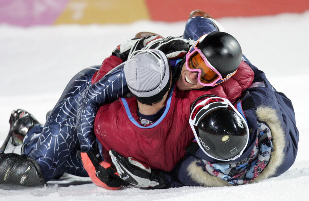 Second Place, Sports Picture Story - Joshua Gunter / The Plain DealerAmerica's Ted Ligety is tackled by teammates Steven Nyman and Scott Macartney at the finish line after he found out that he won the gold in the men's combined alpine skiing, February 14, 2006 in Sestriere Colle, Italy. 