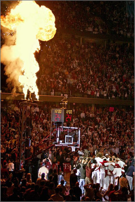 Third Place, Sports Picture Story - Ed Suba, Jr. / Akron Beacon JournalThe Cleveland Cavaliers take the court in a flurry of fan enthusiasm and pyrotechnics before taking on the Washington Wizards in a first round NBA playoff game at Quicken Loans Arena on May 19, 2006, in Cleveland. The Cavaliers eliminated the Washington Wizards in six games, winning the last game at the buzzer that sent them into the semi-finals against the Detroit Pistons. Though they would lose the series in seven games, the team had made the statement that they were now, after years of being a franchise in disarray, a team to be reckoned with in the league.